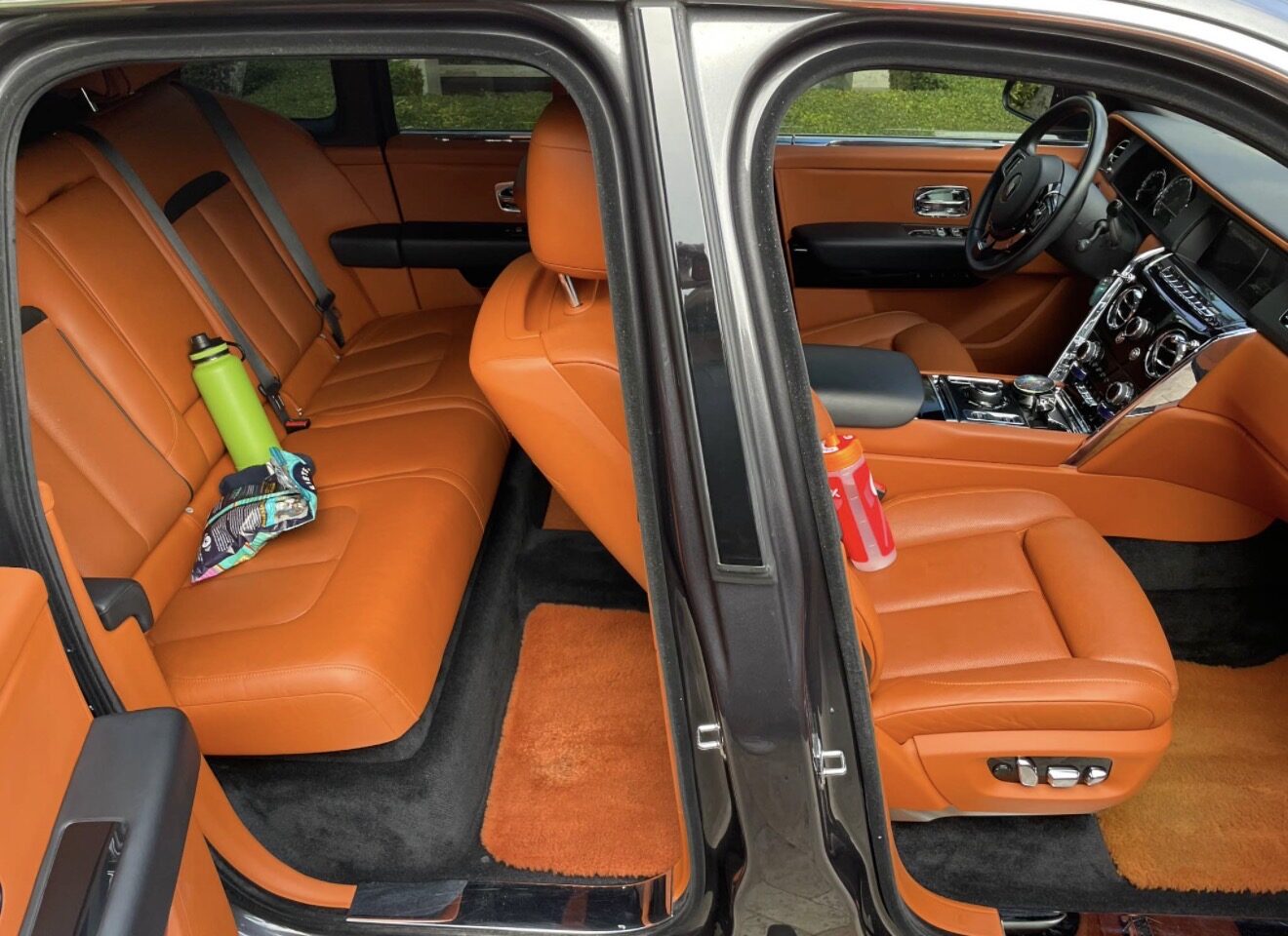 Rolls-Royce Cullinan cognac leather interior detail with hand conditioning by The Detail Club LA — luxury interior detailing Calabasas